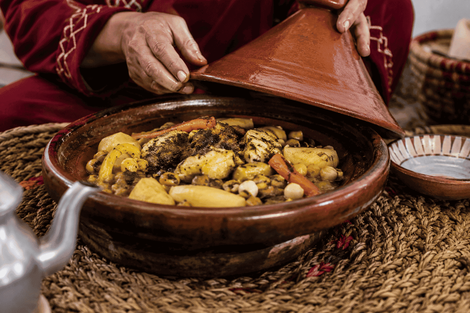 Traditional Amazigh Moroccan food including couscous, tagine, mint tea, and rustic bread, amazigh-food-culture-morocco.jpg