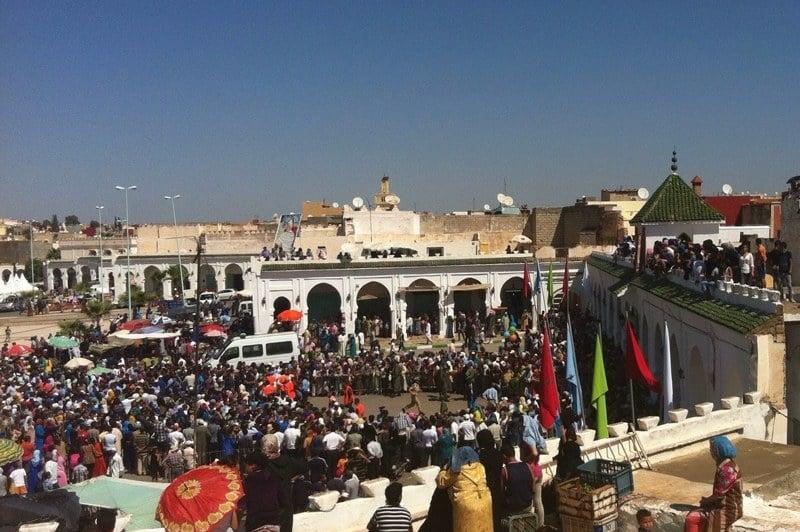Traditional Moussem festival in Morocco featuring cultural celebrations, music, markets, and community gatherings
